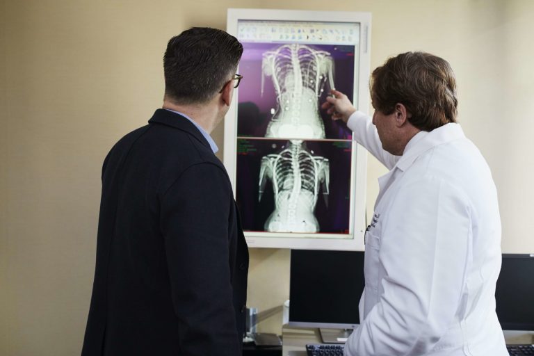 lawyer and doctor reviewing client medical records for social security disability benefits